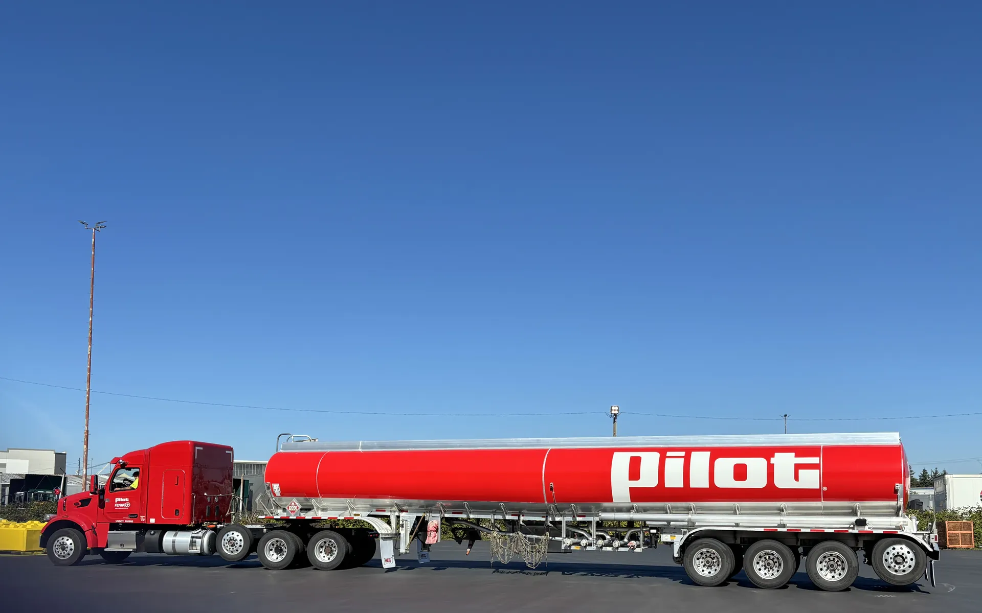 Tanker truck and trailer with fleet graphics installed by High Tech Vinyl